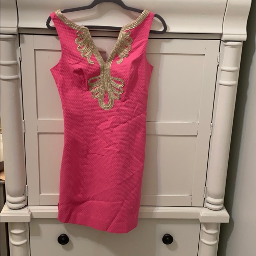 Pink dress with gold neck trim